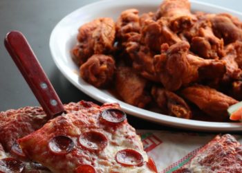 The Reason So Many Pizza Chains Sell Chicken Wings